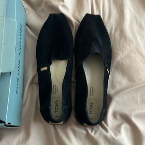 Brand new Toms classic black suede slip on